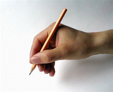 Hand holding pencil | AllAboutLean.com