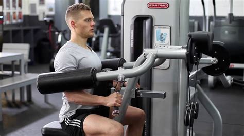 Machine Lateral Raise Guide: How To, Muscles Worked, and Variations