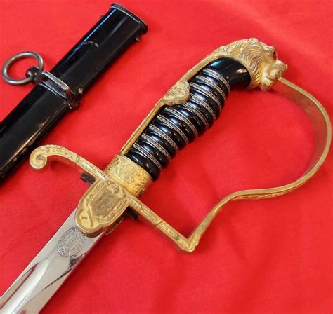 **SOLD** NEAR MINT WW2 GERMAN ARMY LION HEAD OFFICER’S SWORD & SCABBARD – JB Military Antiques