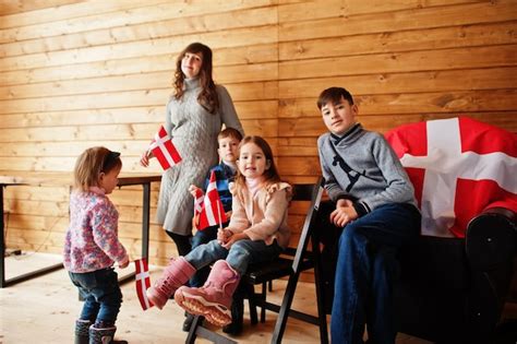 Premium Photo | Family with denmark flags inside wooden house travel to scandinavian countries ...