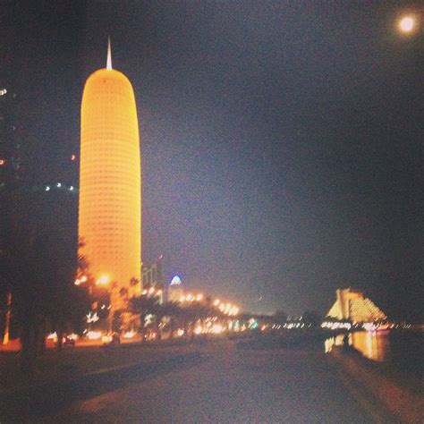 At night on The Corniche, Doha, Qatar. | New york skyline, Skyline, Travel