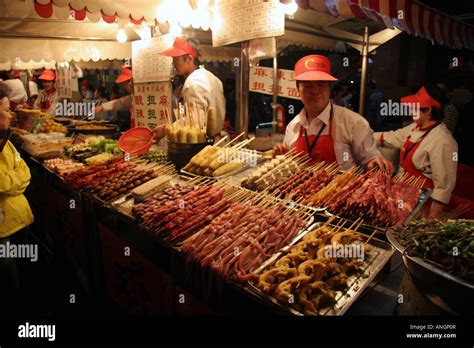 Food stall at a Night Market in Beijing China Stock Photo - Alamy