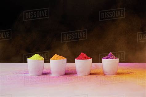 Traditional colorful holi paint in bowls with scattered powder, Hindu spring festival - Stock ...