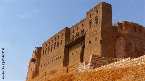 A red citadel on a yellow hill under a bright blue sky Stock Photo | Adobe Stock