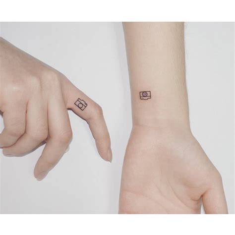 Minimalistic matching cameras tattooed for best