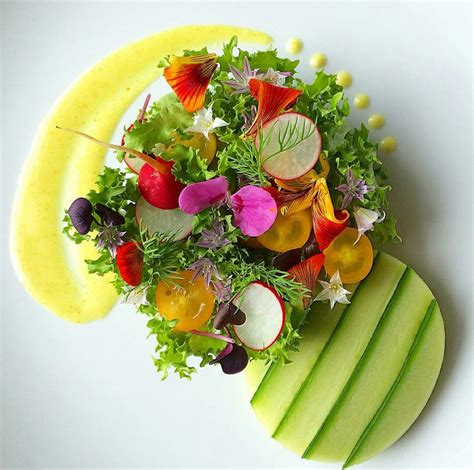 Organic Spring Salad Plating with Curly Endive and Heirloom Tomatoes