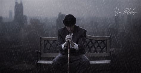 Sad man sitting under the rain photo manipulation