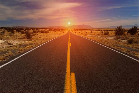 Desert Road And Sunset On Horizon Stock Photo - Download Image Now - iStock