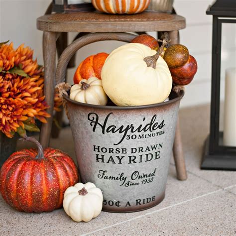 Fill galvanized buckets with pumpkins or fall flowers to create a ...