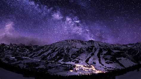 Download Milky Way Snow Night Winter Mountain Man Made Village HD Wallpaper