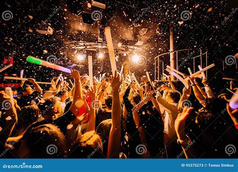 Nightclub crowd dancing editorial stock photo. Image of hand - 95375273