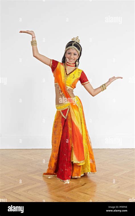 Teenage girl performing Bollywood dance moves, based on Arabic dances (belly-dancing Stock Photo ...