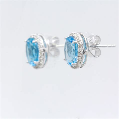 18ct White Gold Blue Topaz and Diamond Earrings | Allgem Jewellers