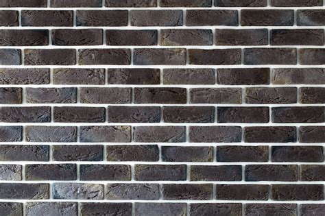 Free Photo | Dark brown brick wall