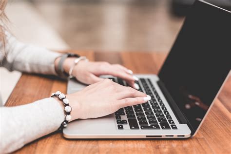 Young Woman Working/Typing on Her Laptop Free Stock Photo Download | picjumbo