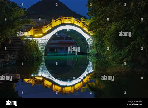 Night view of arch bridge Stock Photo - Alamy