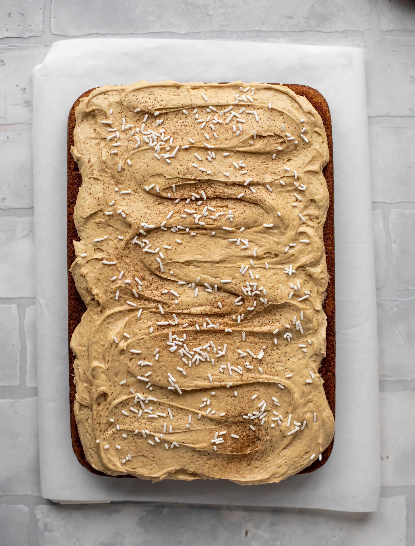 This banana cake is a delicious twist on banana bread! Covered with coffee cream cheese frosting, it’s an easy and wonderful treat.