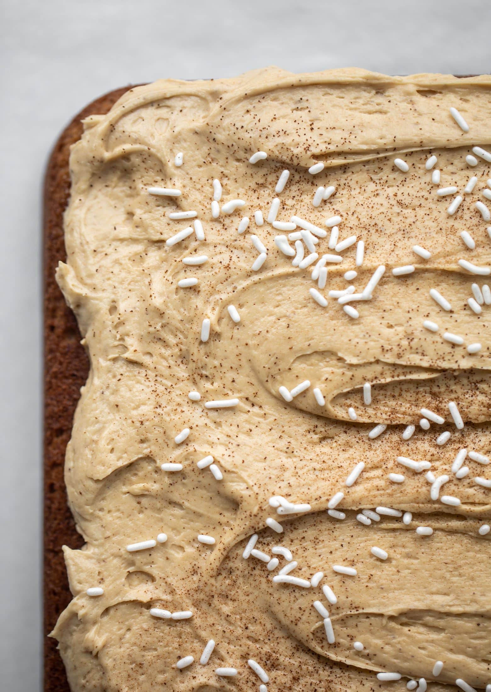 This banana cake is a delicious twist on banana bread! Covered with coffee cream cheese frosting, it’s an easy and wonderful treat.