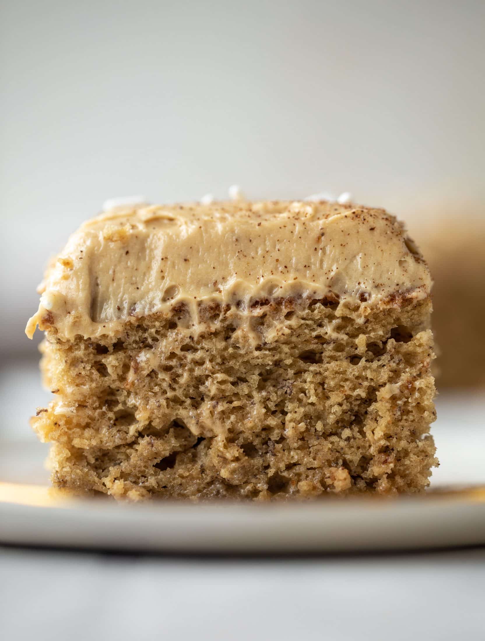 This banana cake is a delicious twist on banana bread! Covered with coffee cream cheese frosting, it’s an easy and wonderful treat.