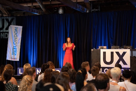 Kat Zhou on stage at UX London.