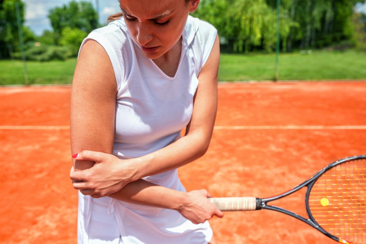 photo of a female tennis player with a tennis elbow