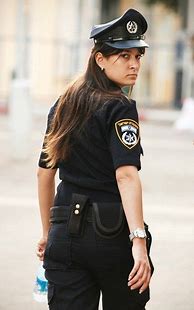 Image result for Photograph of Woman Against Police Shield