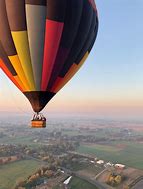 Image result for Images of Hot Air Balloons Over Water