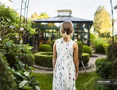 Image result for A Girl Standing in Beautiful Garden Photos