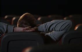 Image result for Man Sitting On Stage in Empty Theatre with Spotlight