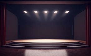 Image result for Man Sitting On Stage in Empty Theatre with Spotlight