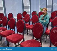 Image result for Man Sitting On Stage in Empty Theatre with Spotlight