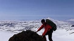 Rock climber on the top of mountain.