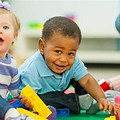 Preschool Children Playing with Babies