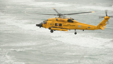 An MH-60 Jayhawk helicopter flies near the North Head Light in Ilwaco, Wash., during a training flight, Nov. 10, 2016. Training is an essential daily activity for aircrews so they can improve their professional proficiency. U.S. Coast Guard photo by Petty Officer 1st Class Levi Read.