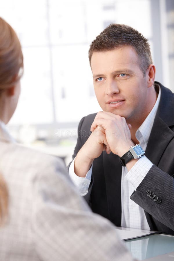 Business people talking at desk