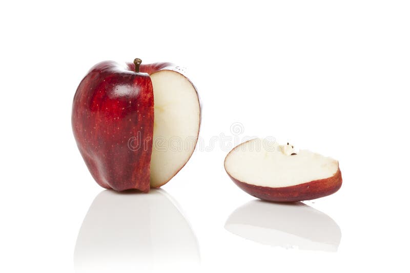 A fresh red apple with a slice cut out