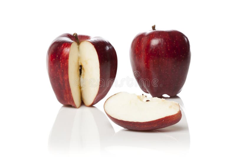 A fresh red apple with a slice cut out