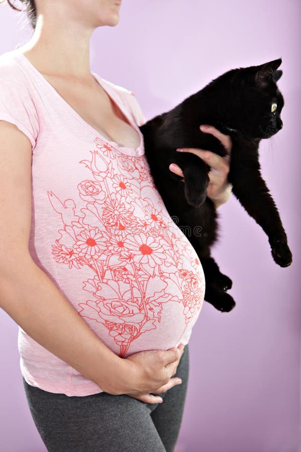 Pregnant woman with cat.