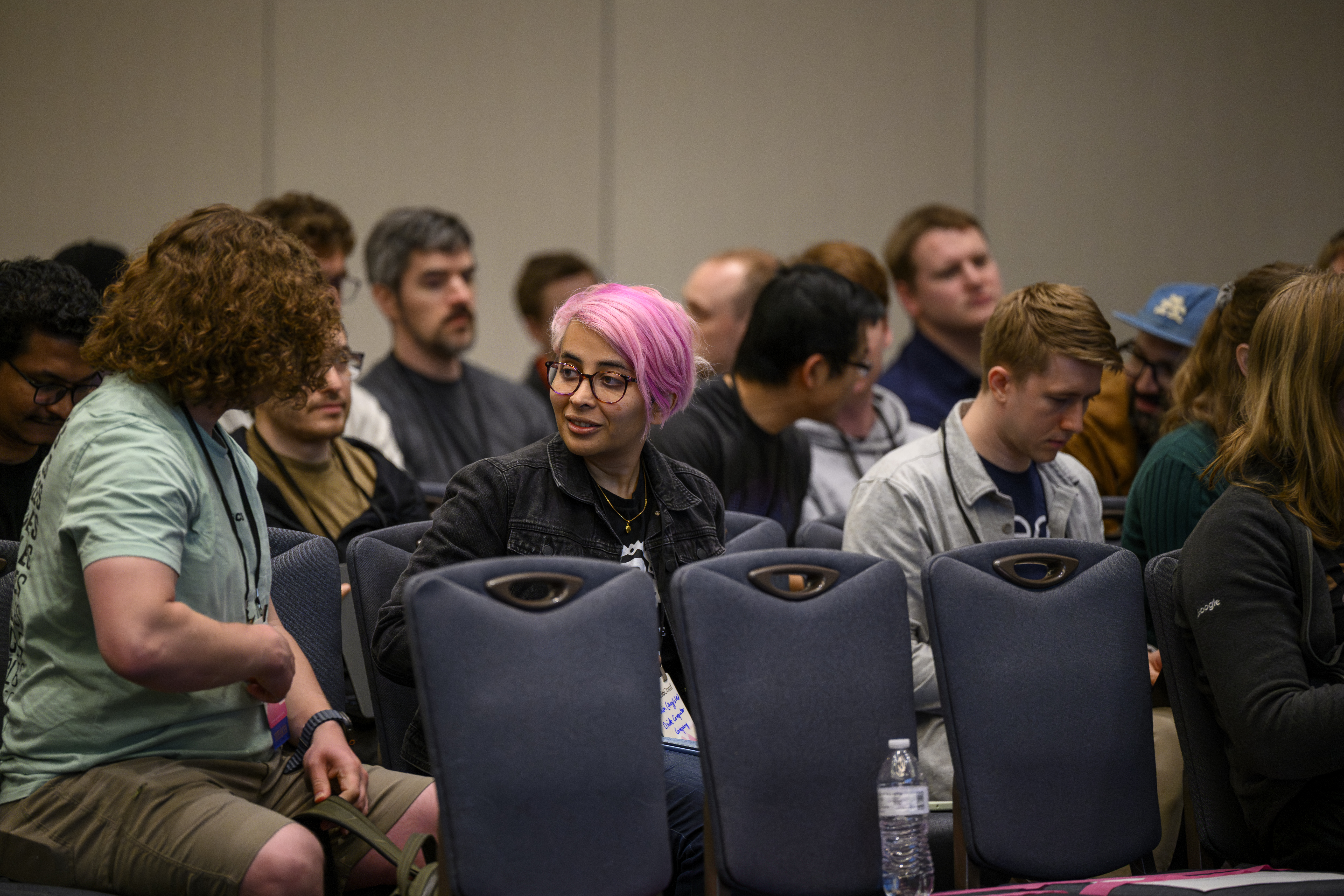 audience members chatting between sessions at TokioConf 2026