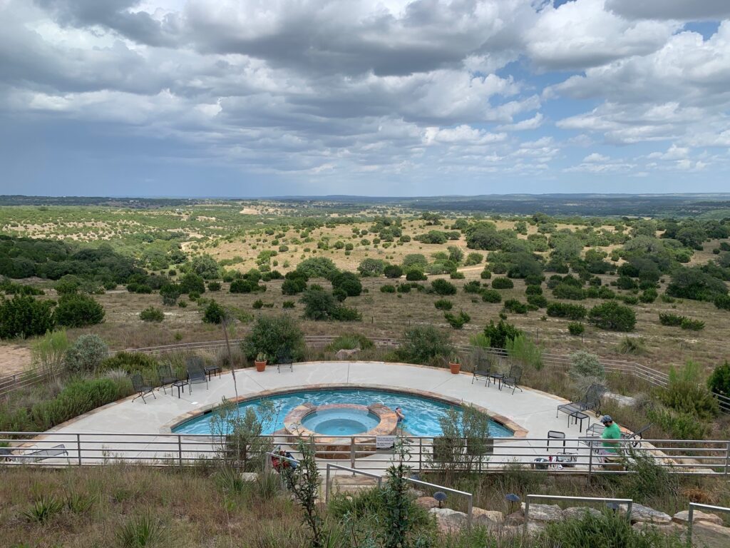 View of resort pool and beyond at Arc De Texas