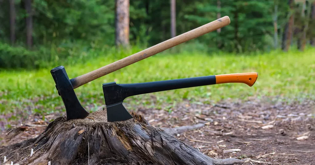 Maul and Splitting Axe Cut into an Old Tree Stump