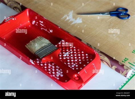 Brush, scissors, repair work. Tools for cut, gluing wallpaper and room renovation Stock Photo ...