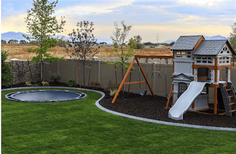 Trampoline Backyard Ideas For Tons Of Outdoor Fun - arinsolangeathome