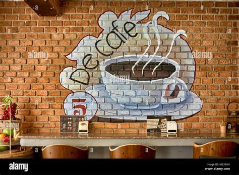 Coffee shop interior wall art advertising Stock Photo - Alamy