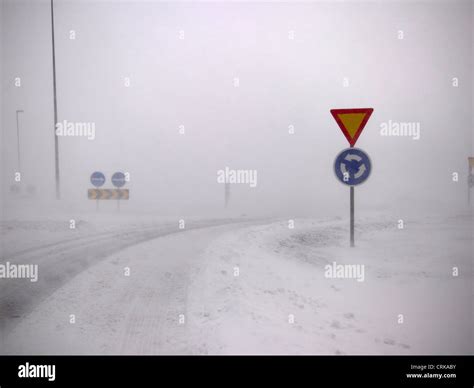 Road signs in snowy landscape Stock Photo - Alamy