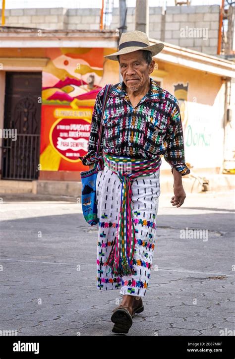 San Juan, Lake Atitlan, Guatemala, 1st Mar 2020: Mayan man in traditional clothing walking in a ...