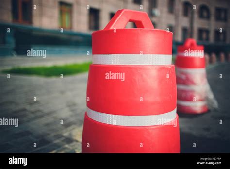 road red plastic block safety fencing repair work on carriageway fencing of excavated pits ...