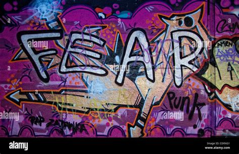 Graffiti on a wall showing the word FEAR Stock Photo - Alamy