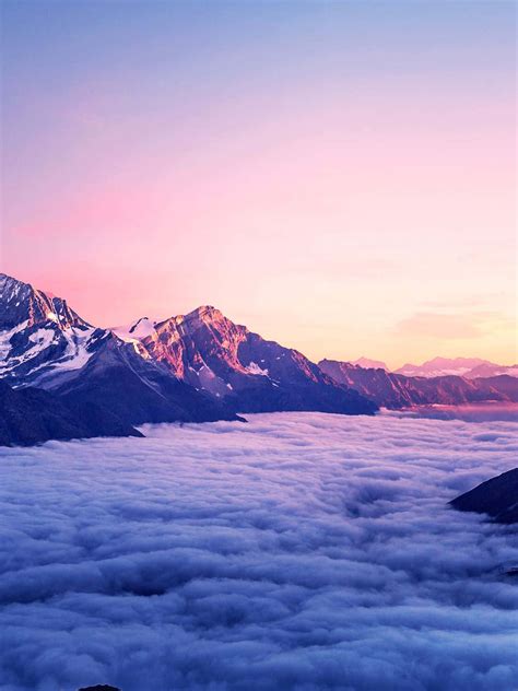 Download 1440p Nature Background Surrounded By Clouds | Wallpapers.com