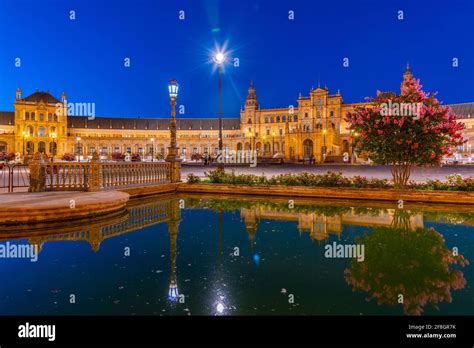 Plaza de Espana reflected on water during night, Sevilla, Spain Stock Photo - Alamy